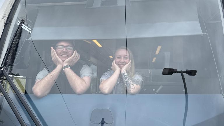 Jason and Kira pose inside the tram